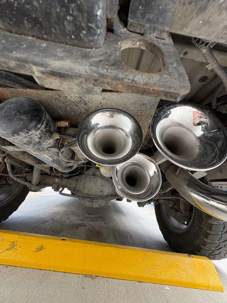 Wide undercarriage view chrome Outlaw 228H train horns mounted under rear of Jackson's 2018 Chevy Silverado 1500 Z71 photo 5