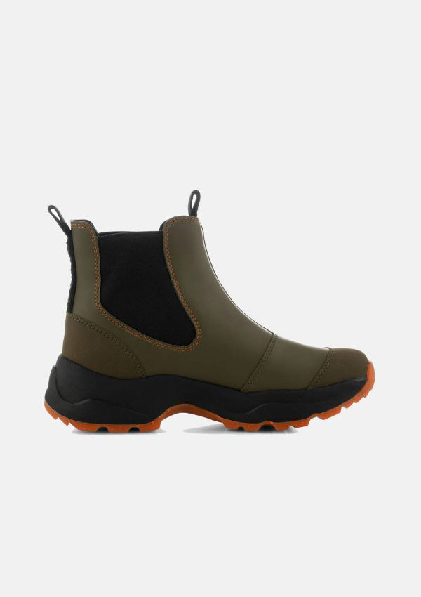 Product image of Woden Siri Waterpoof boot in Dark Olive. A Chelsea Boot style ankle boot with a chunky black and bright orange track sole, Dark Olive upper with orange stiching around a black fabric ankle gusset and ties at the front and back of the top of boot .