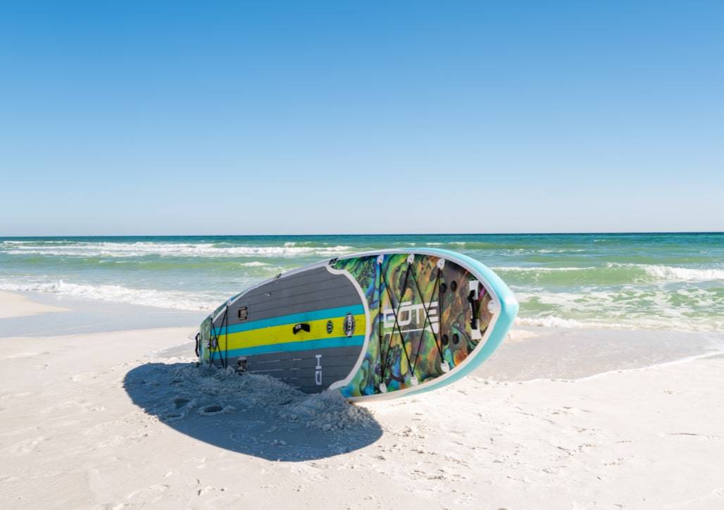 Inflatable SUP on sandy beach