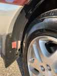 Black air line brass fittings routed behind rear wheel well mud flap maroon gold Subaru Outback Adam's 228H gallery photo 5