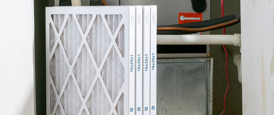 Air filter installed in an HVAC system, with visible ductwork.
