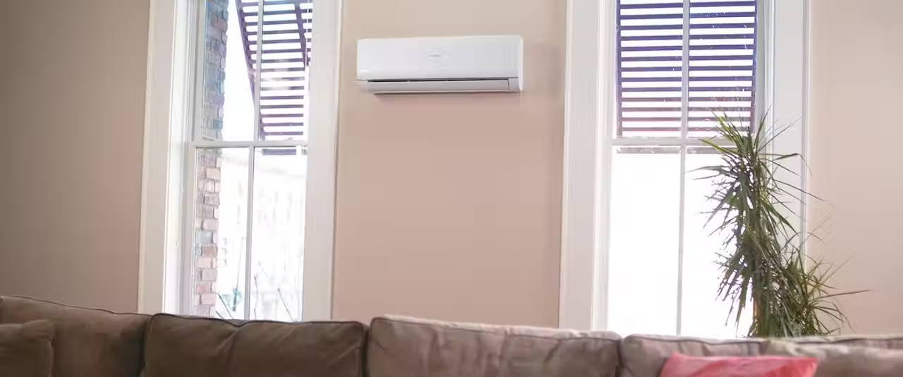 Living room wall with a Haier ductless unit on the wall.