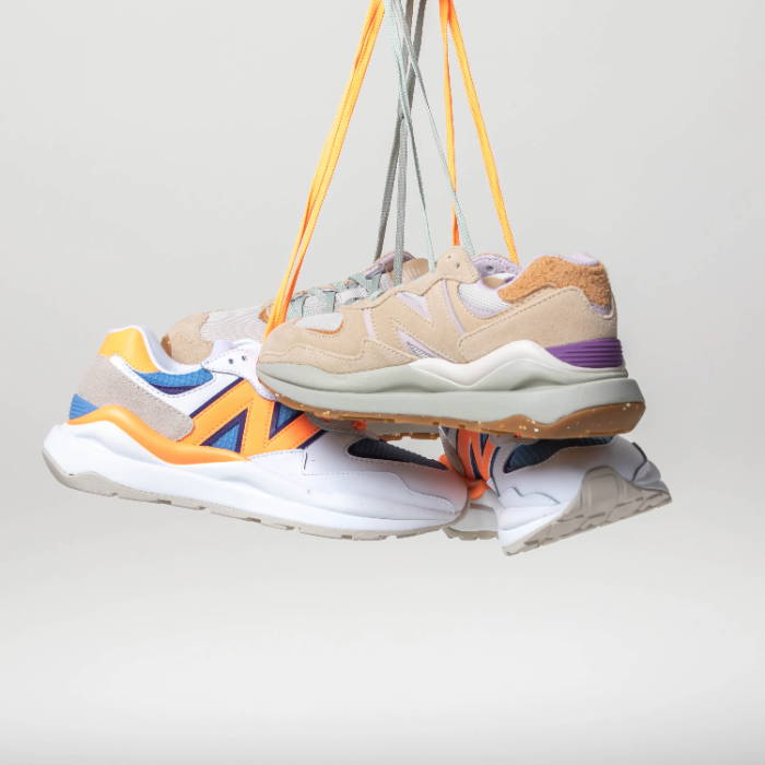 new balance sneakers hanging by shoelaces