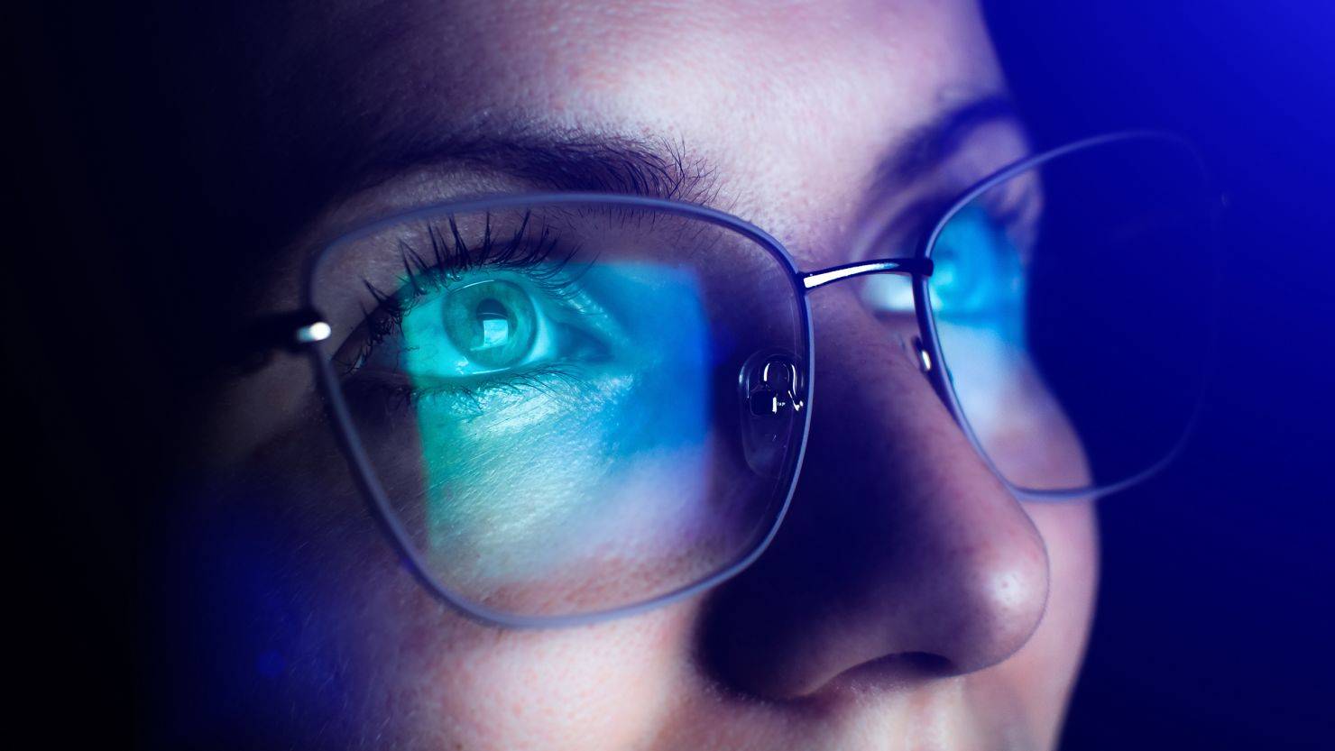 Man wearing blue light glasses