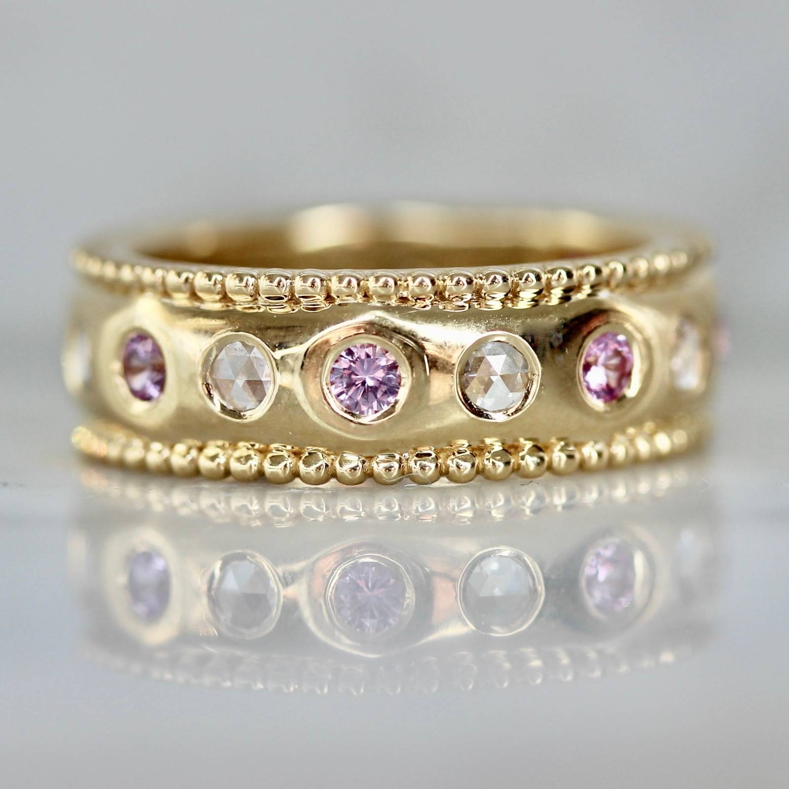 Thick gold band with pink sapphires and diamonds