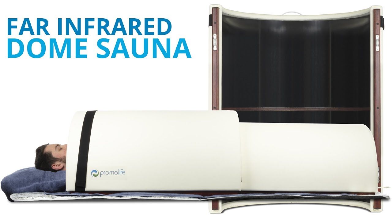 Far infrared dome sauna with a person lying inside.