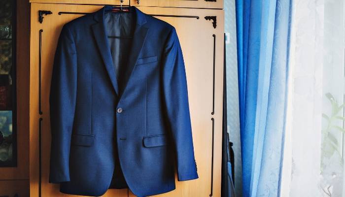 Suit jacket hanging on wardrobe