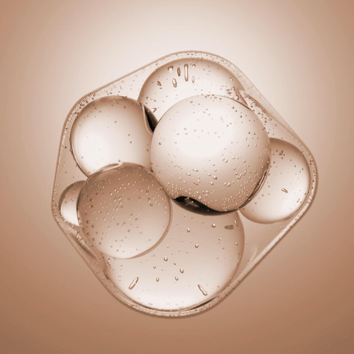 Group of translucent spheres with bubbles on a soft, neutral background.