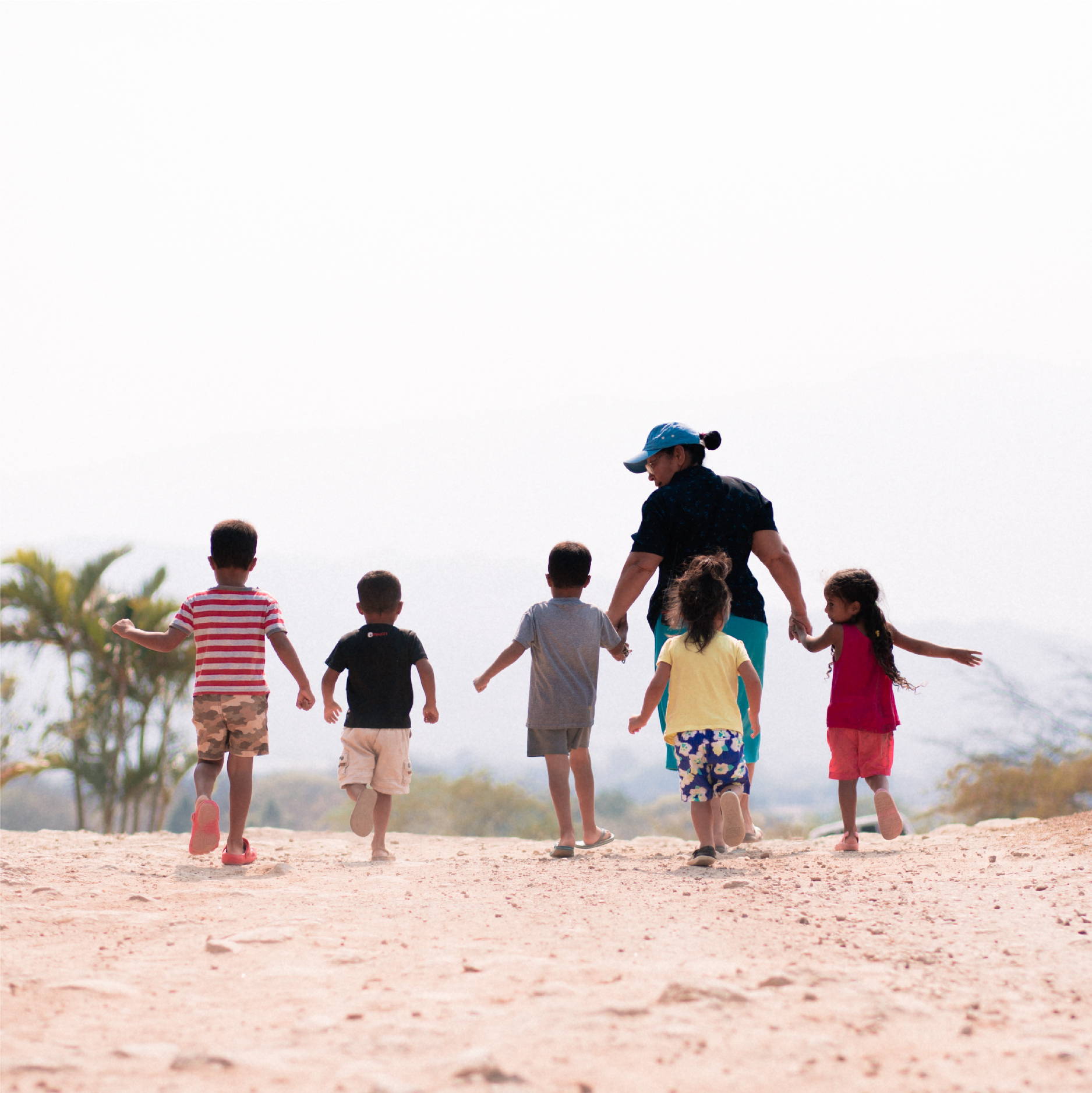 A group of young children walk with their tia to the Comador at Good Shepherd Children's Home in Zamarano Valley, Honduras