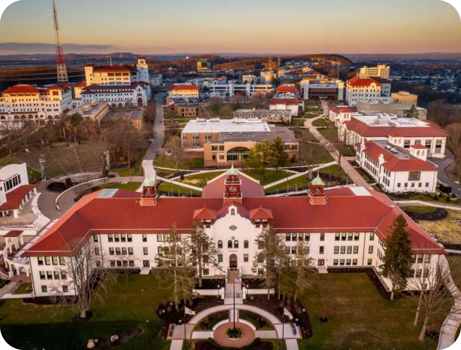 Aerial view of a university campus with buildings and landscaping.