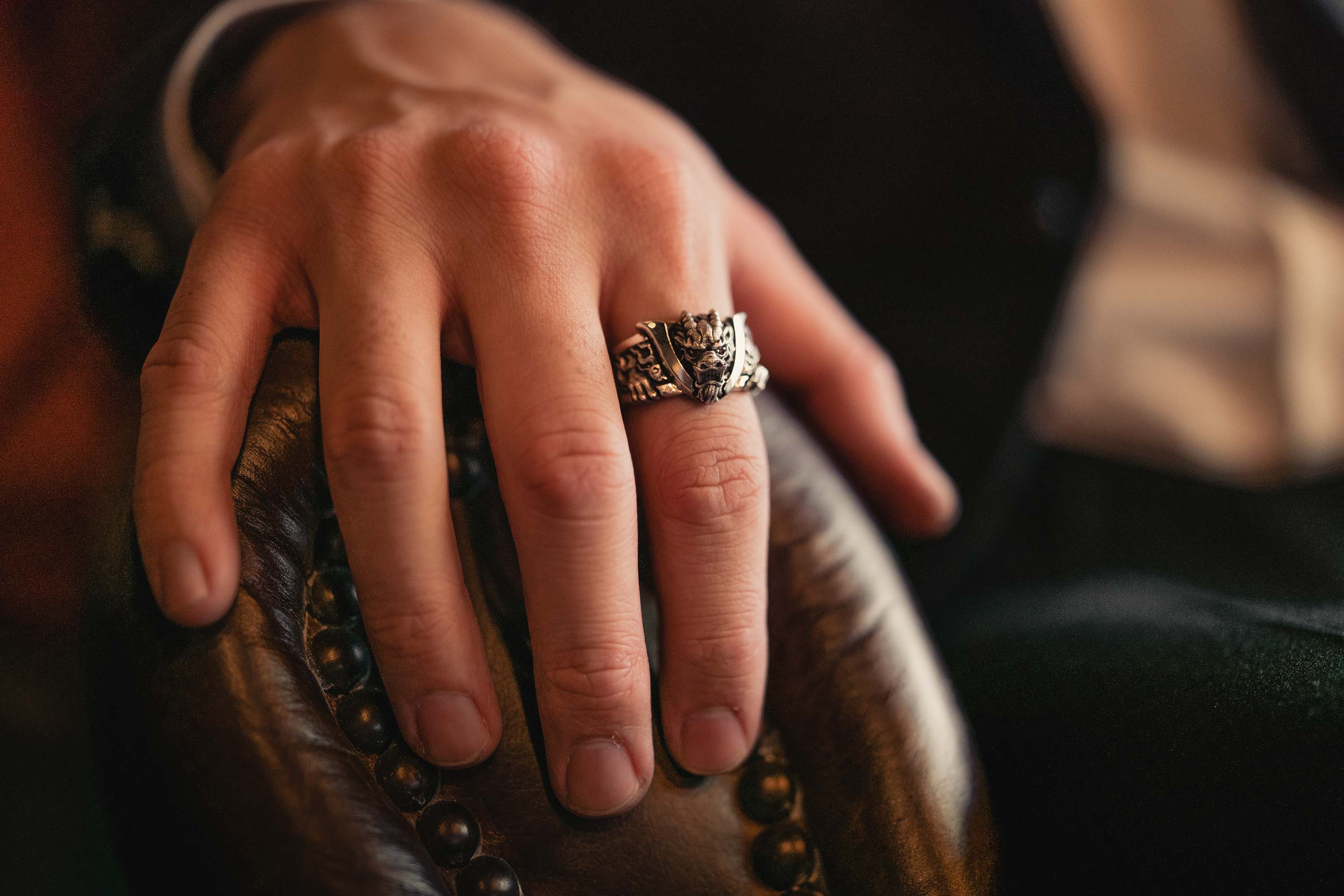 Man's hand wearing Bushido Band Ring by NightRider Jewelry