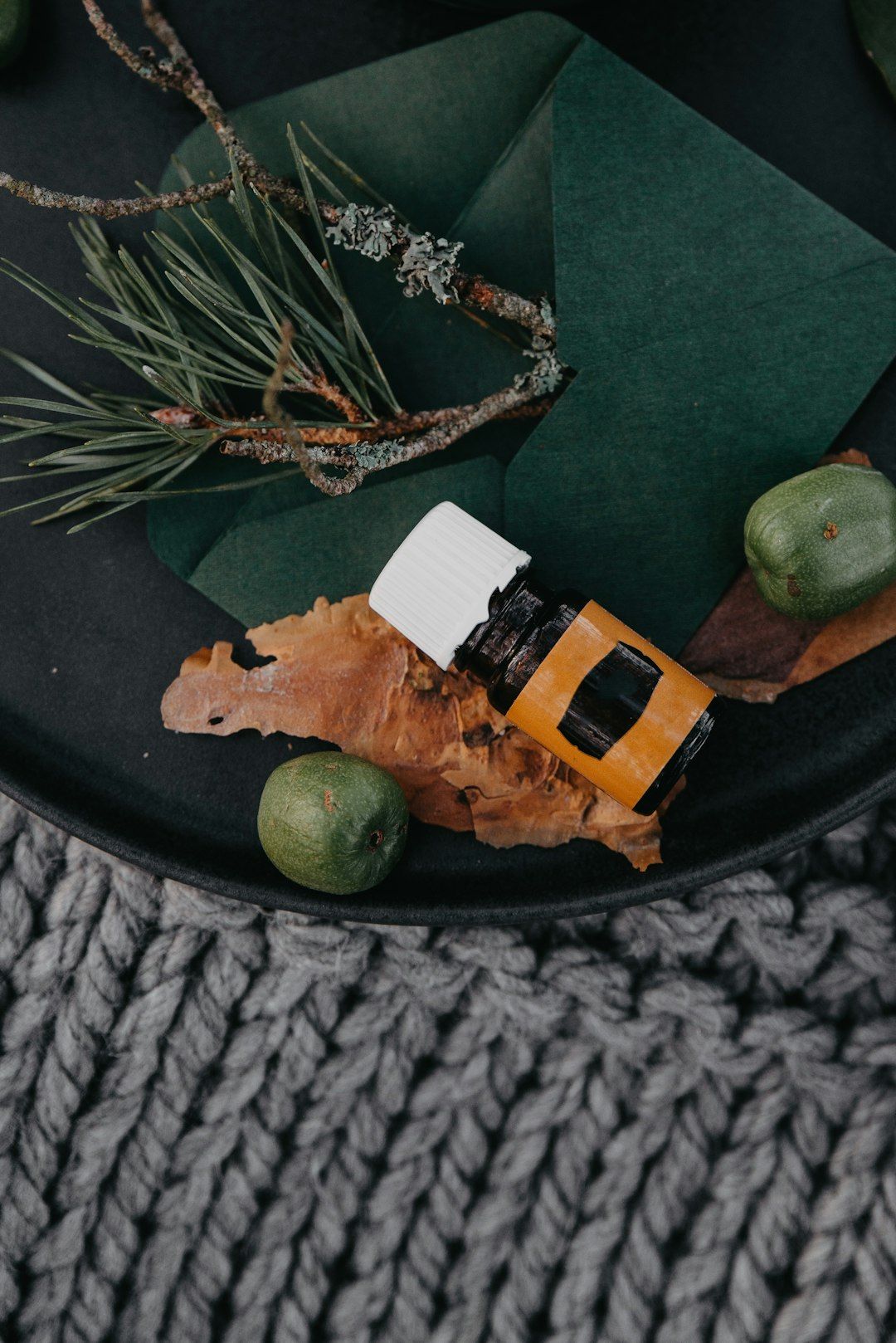 a small toy car sitting on top of a black plate