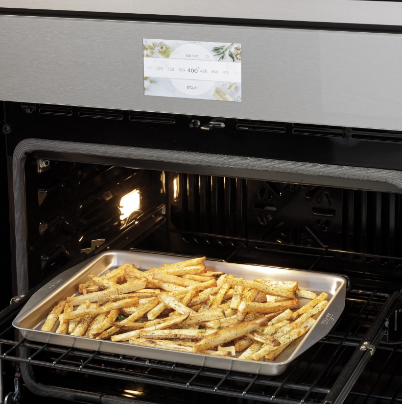 Cafe Air Fry oven with a tray of golden-brown fries inside.