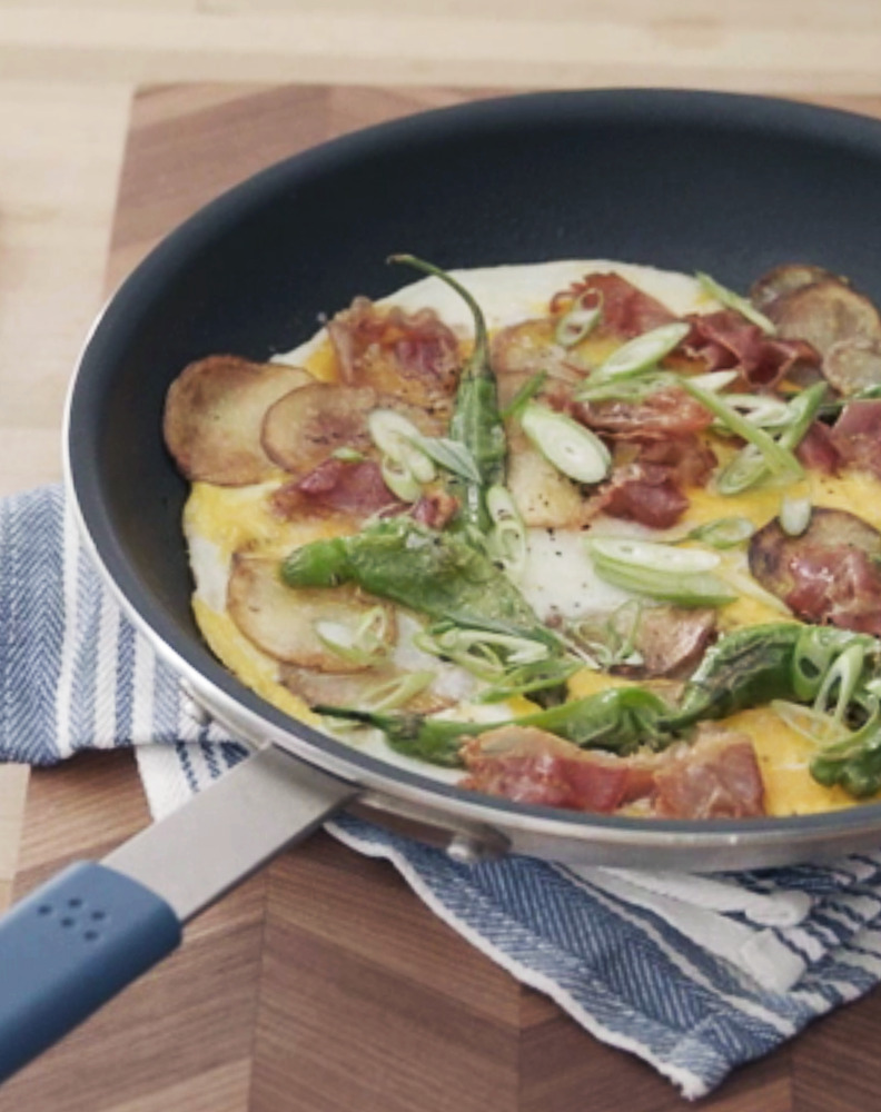 You can comfortably stir and spread omelette ingredients within the Misen Nonstick Pan, ensuring an even cook-through.