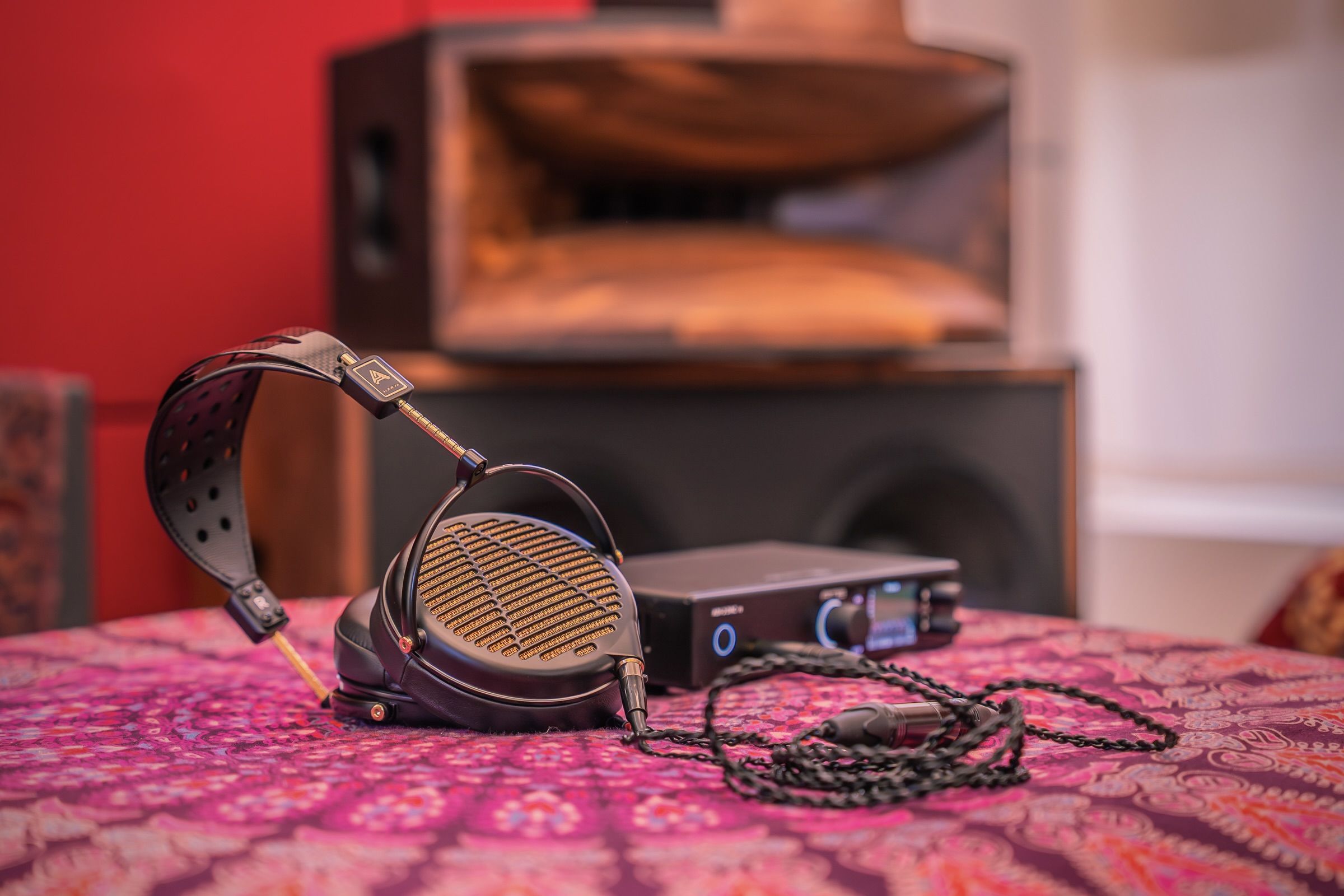 Audeze LCD-4z laying on cushion with RME adi Dac