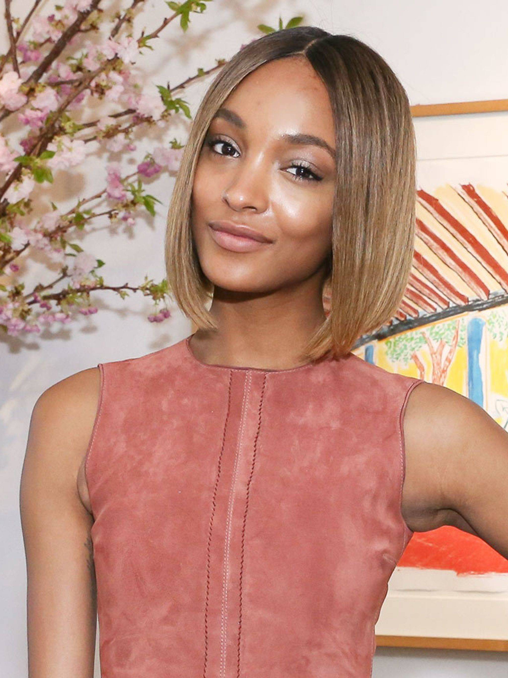 Woman with a brown and blonde layered angled bob