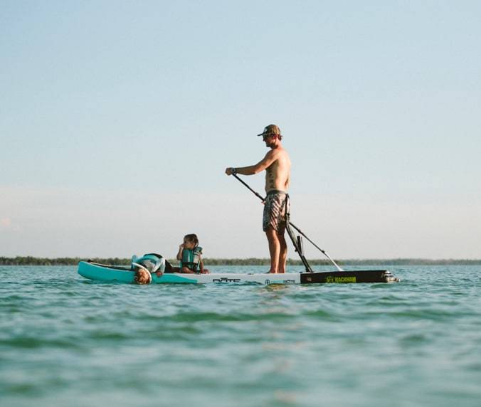 Paddle boarding with two kids