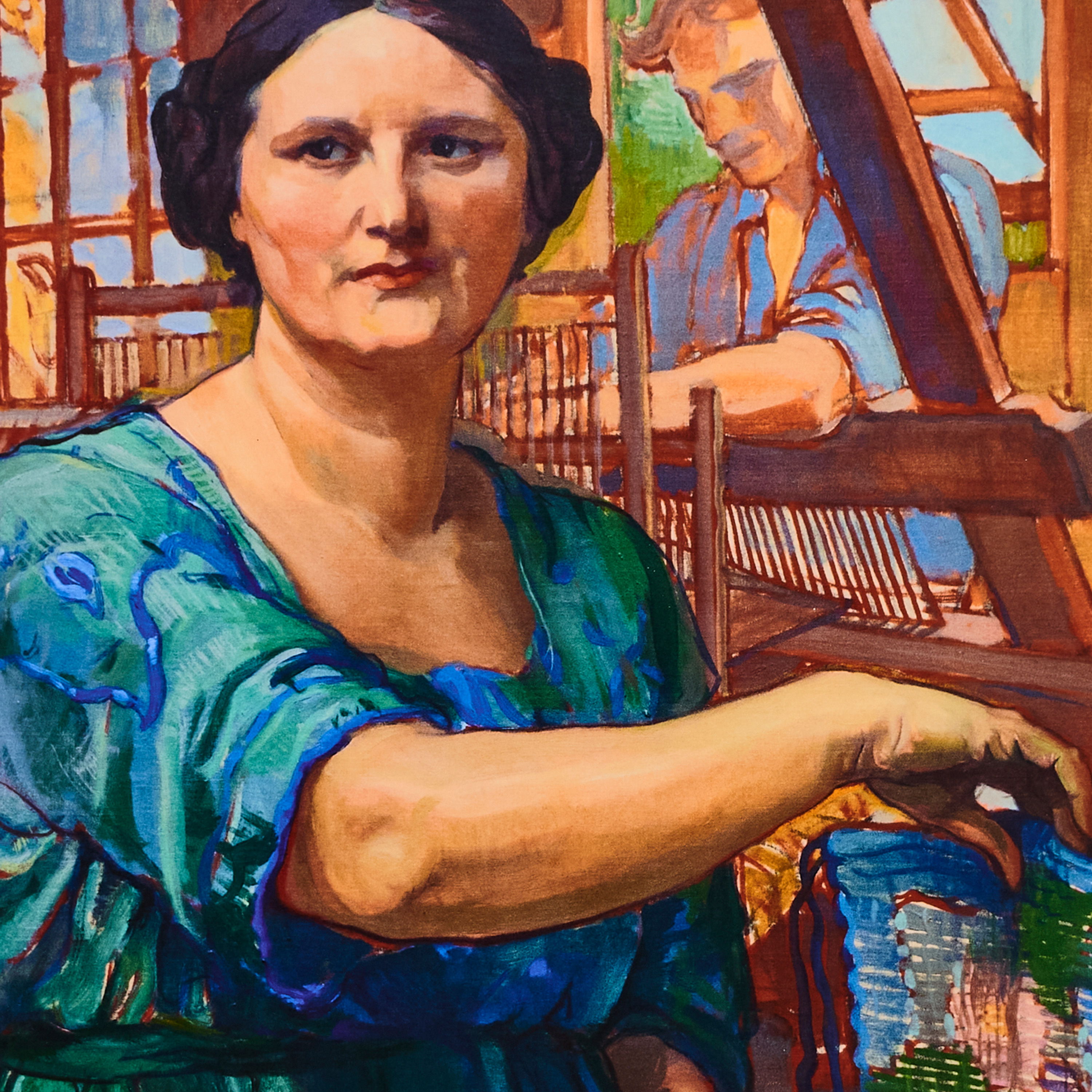 A woman in a blue dress posing with a weaving background.
