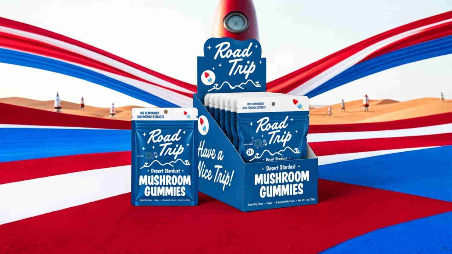 Boxes of mushroom gummies against a colorful, wavy background.