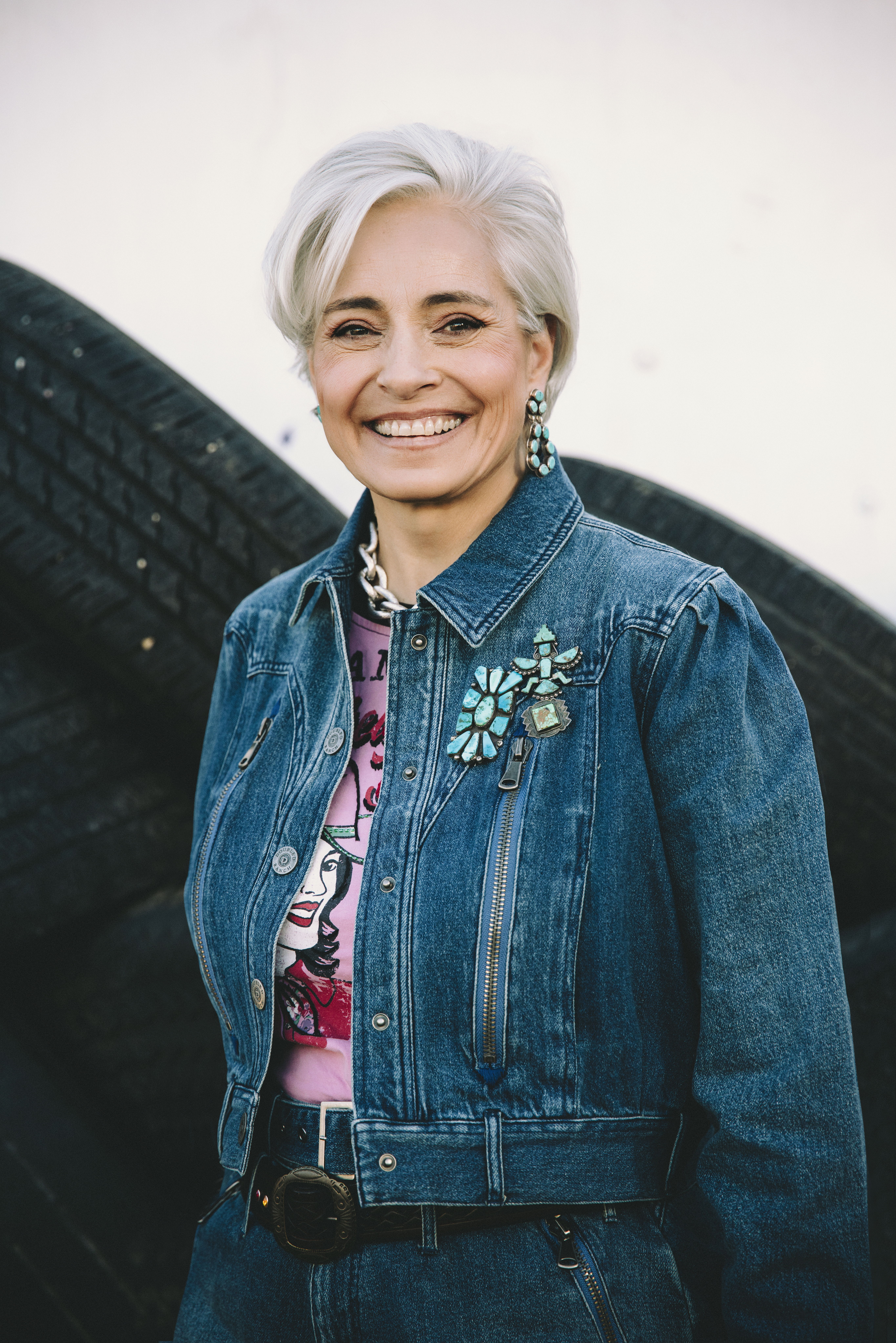 Hedy wearing the Spur Line Jacket and Barbed Wire Baby Tee with beautiful turquoise jewelry.