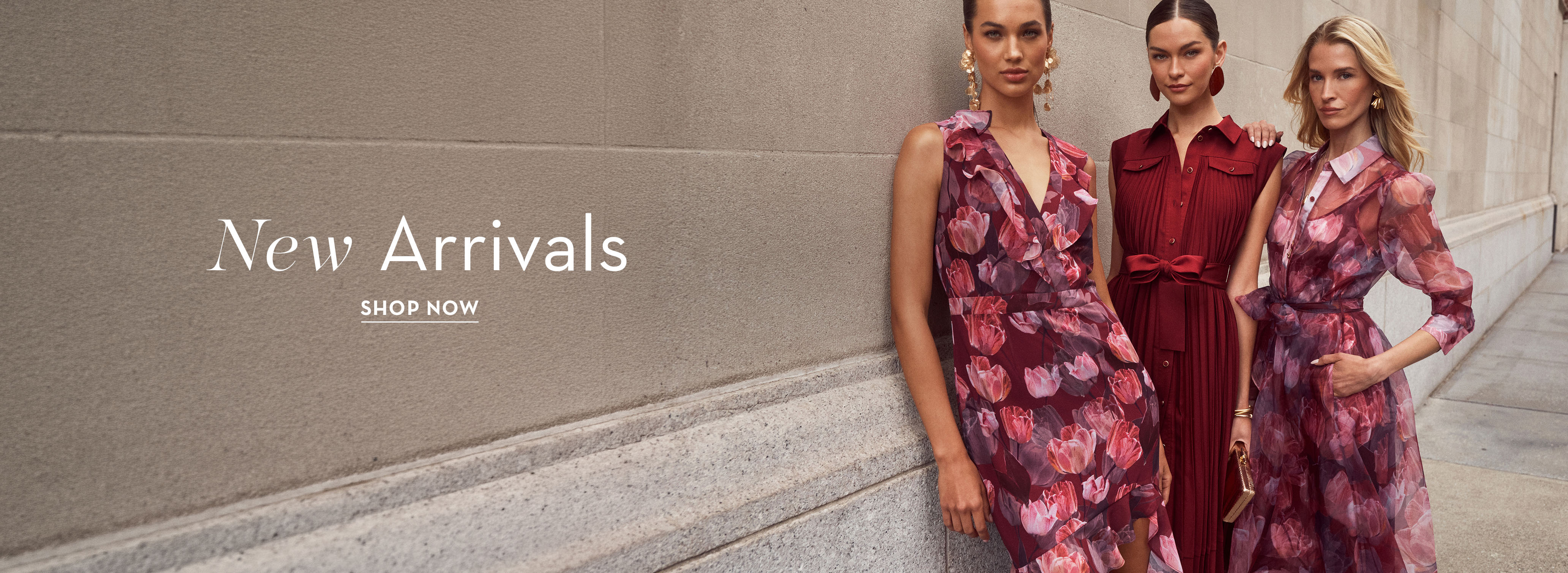 Three models showcasing new arrivals in stylish dresses.