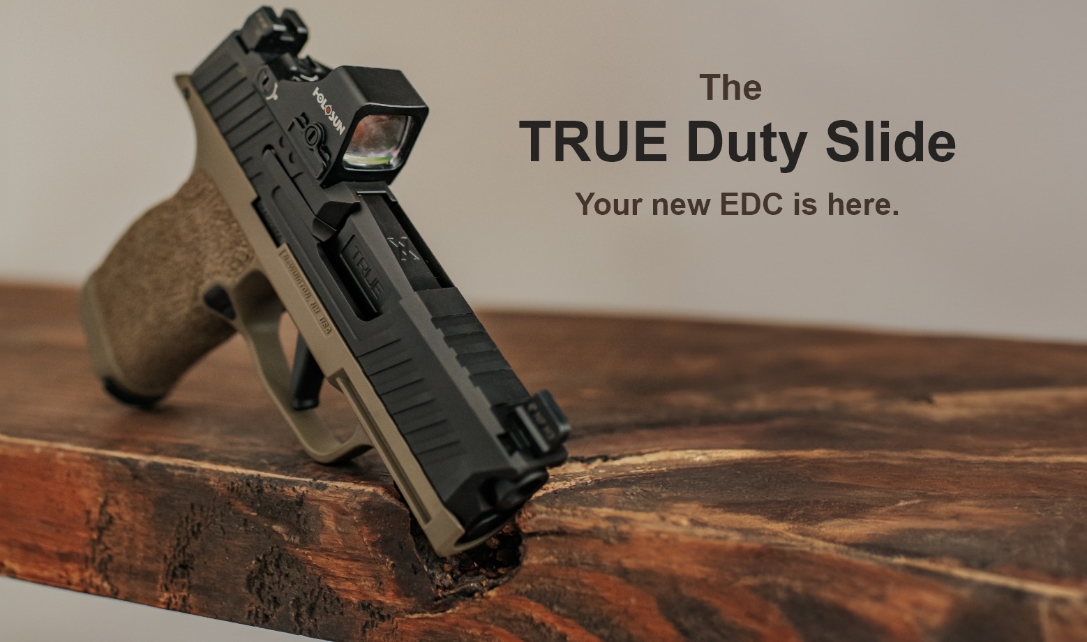 SIG Sauer P365 with TRUE Duty Slide and red dot sight, 'Your new EDC is here' text, on wooden surface.