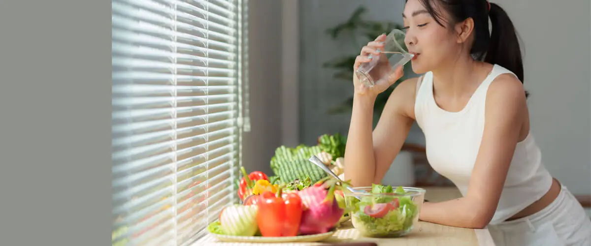 Healthy lifestyle foods and water supporting collagen production and skin health.