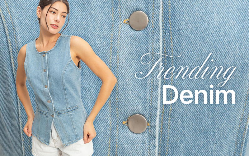 Woman wearing a denim top with text 