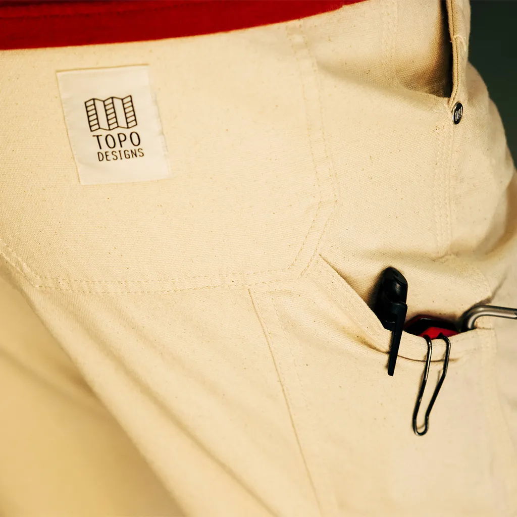 Logo on light pants with a pocket and clip.