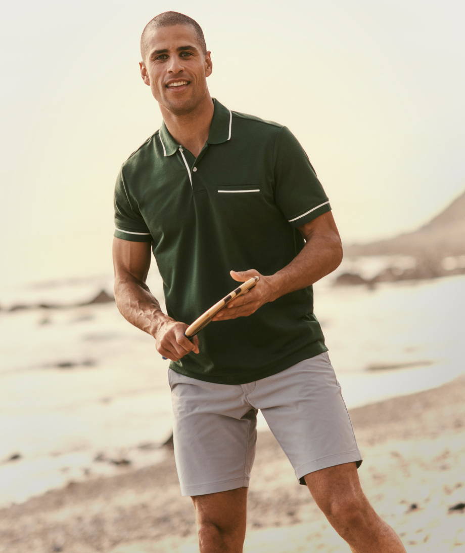 Model is wearing UNTUCKit Tipped Performance Polo.