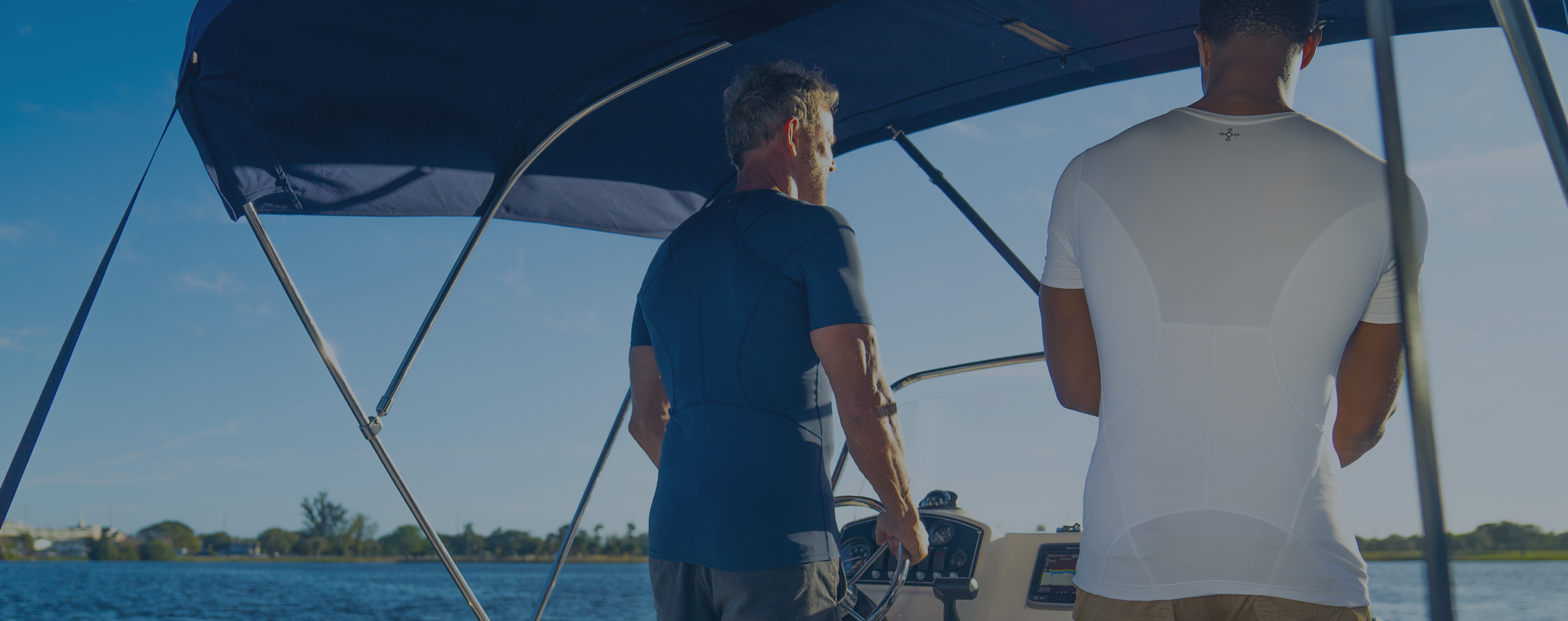 Men boating wearing Tommie Copper compression tops