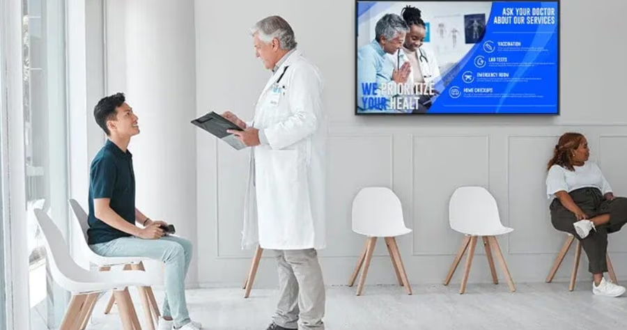 A doctor consulting a patient in a modern waiting room.