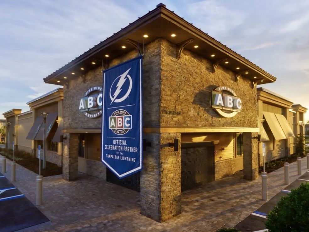 ABC restaurant with a large banner and stone exterior.