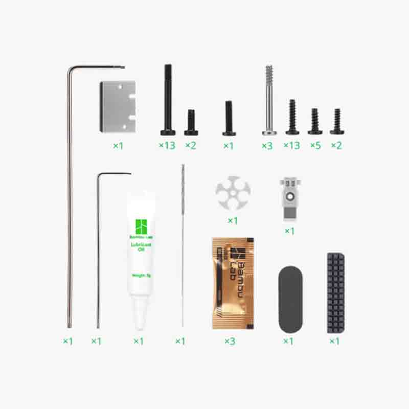 Collection of tools and components, including screws, wrenches, and adhesive.