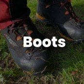 Black boots on grass with the word 