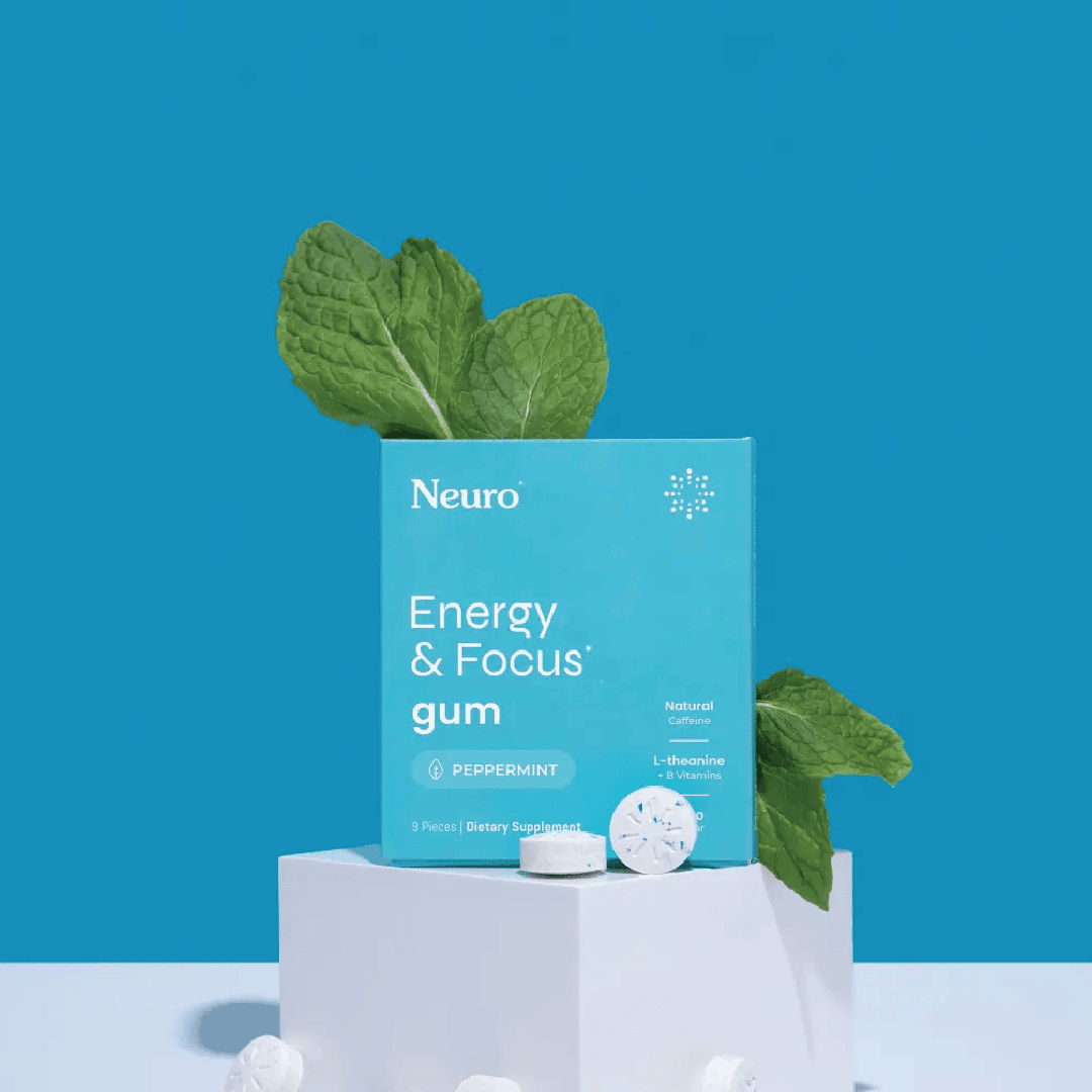Energy and Focus gum product packaging with mint leaves on a blue background.