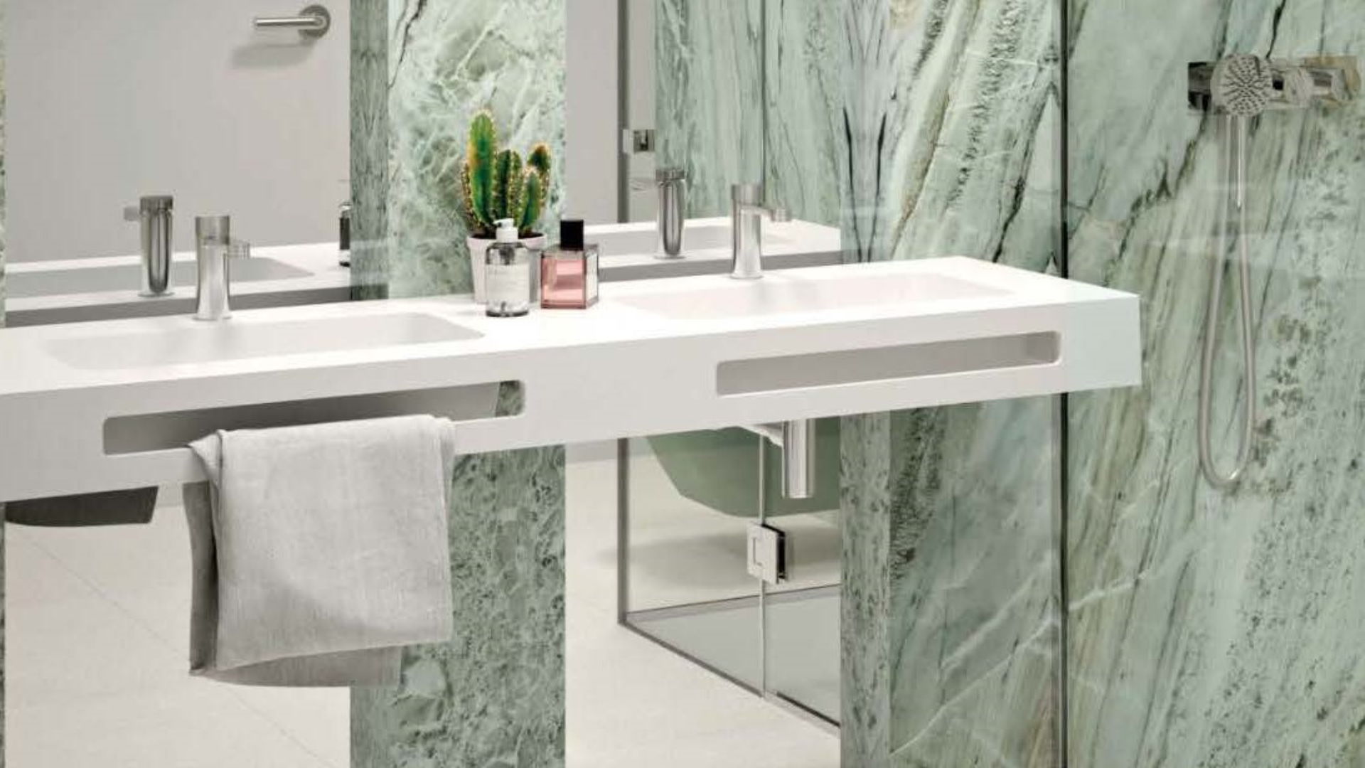 Modern bathroom with large green marble effect Alluslate wall panels and a sleek white double basin.