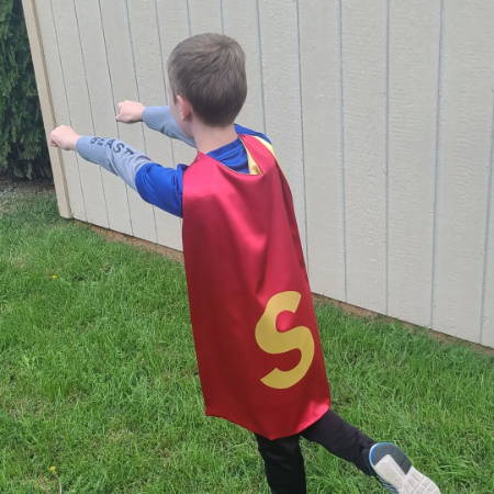 Boy Wearing Superhero Cape