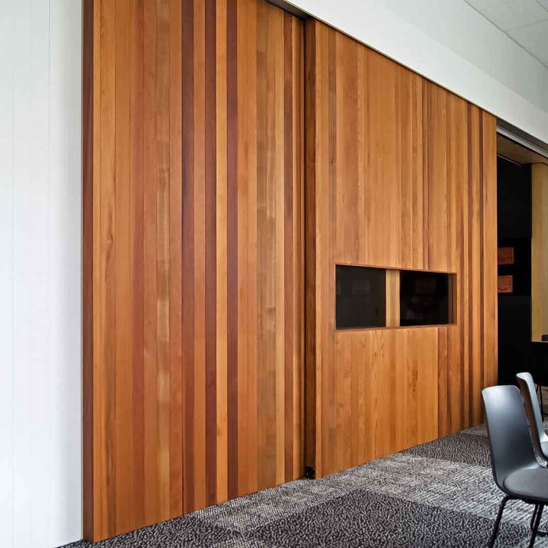 Large Sliding Wooden Door installed in an office space.