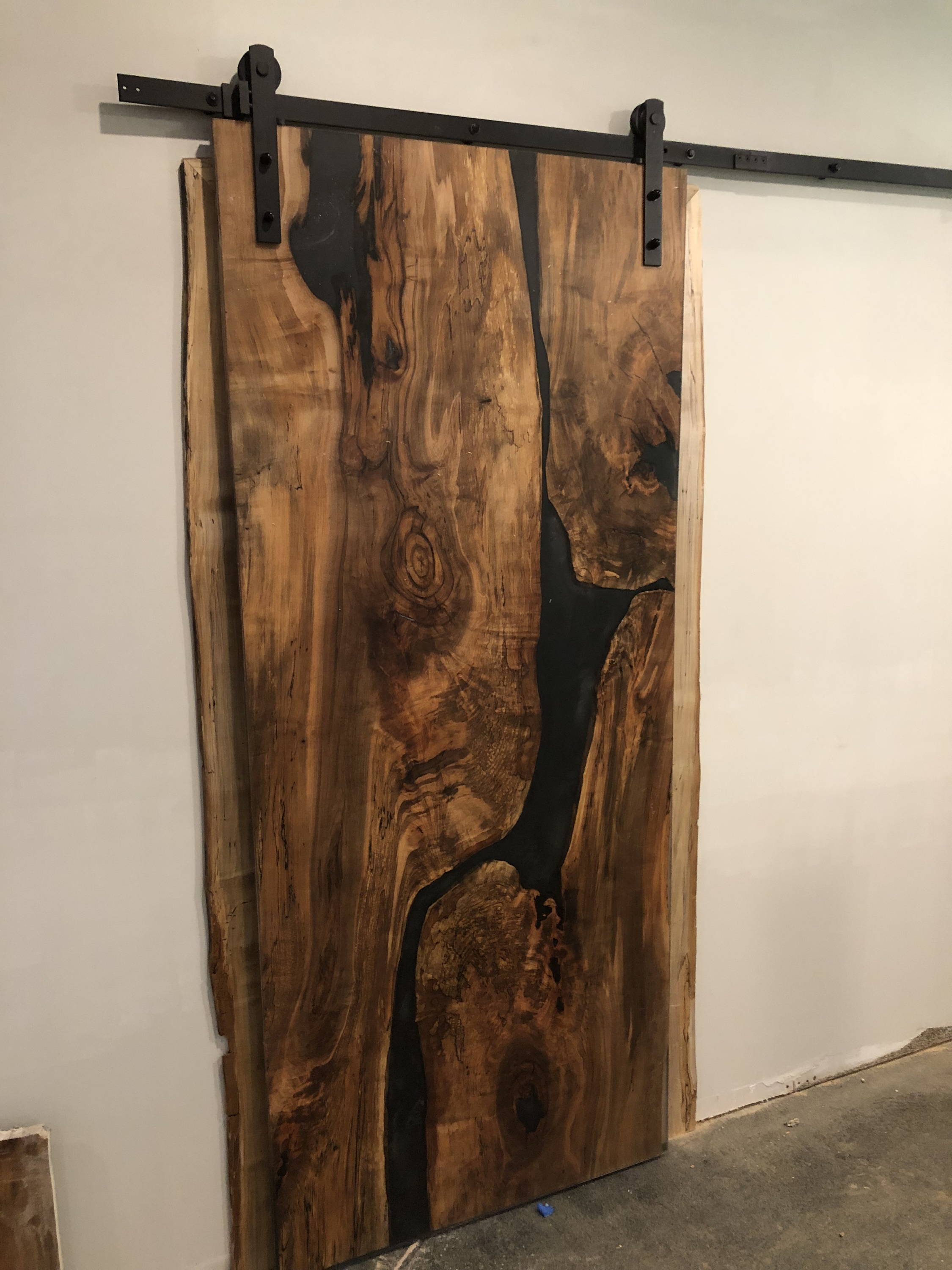 sliding door built from one large wood slab
