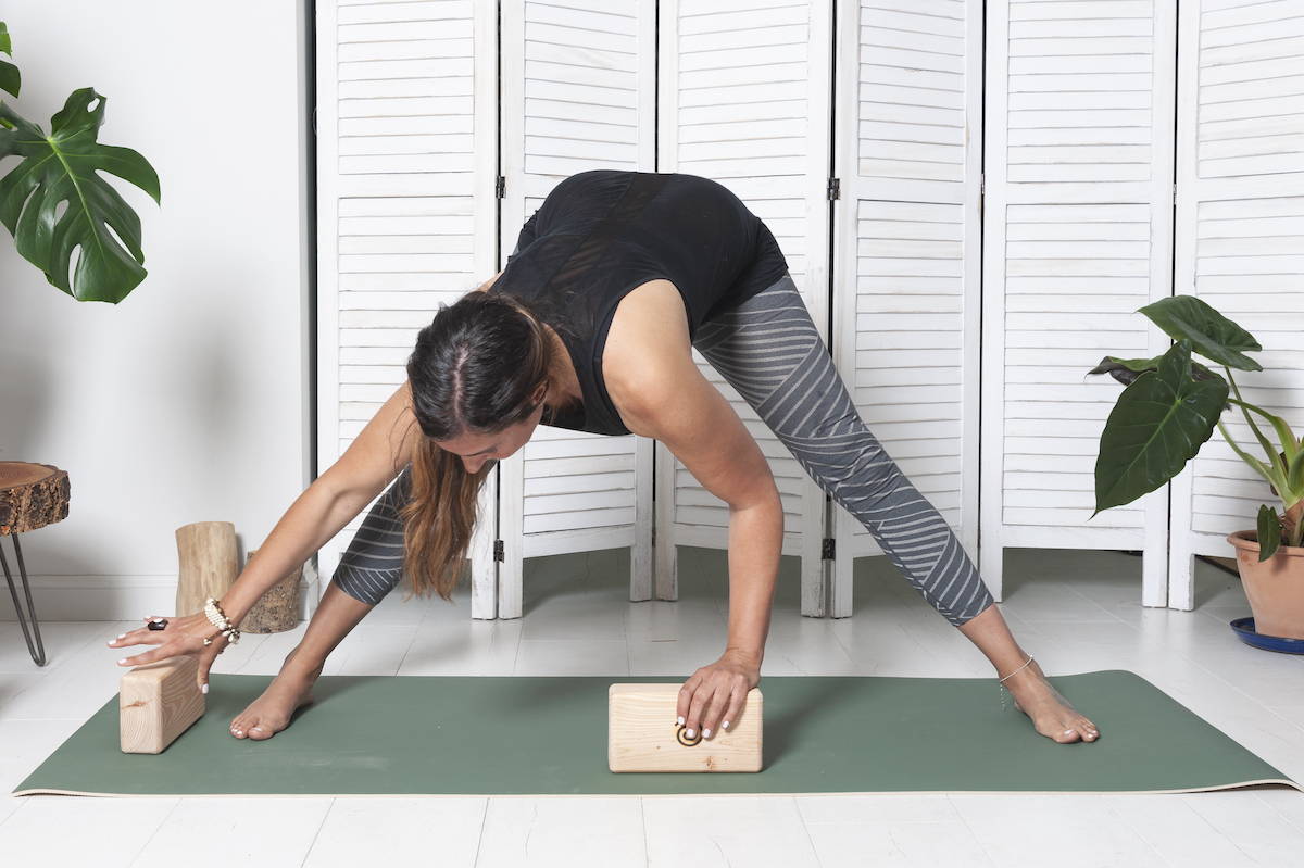 reaching-for-a-wooden-yoga-block