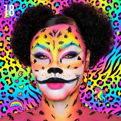 Person with colorful, animal-inspired makeup against a vibrant, patterned background.