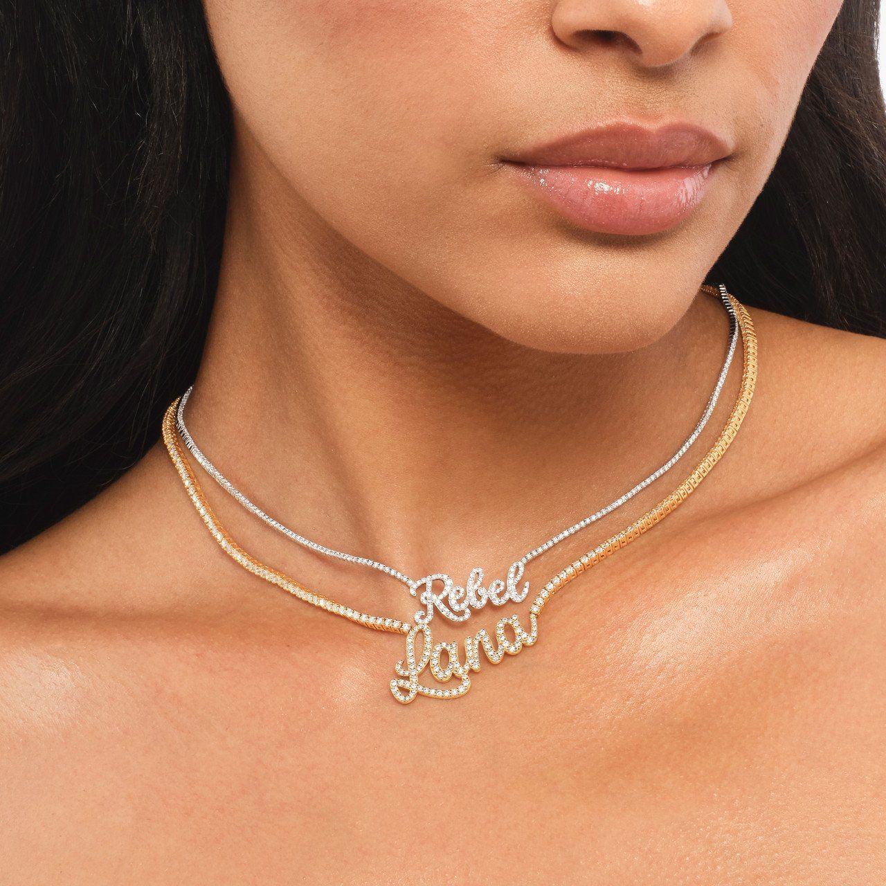 Close-up of a person wearing a necklace that says 