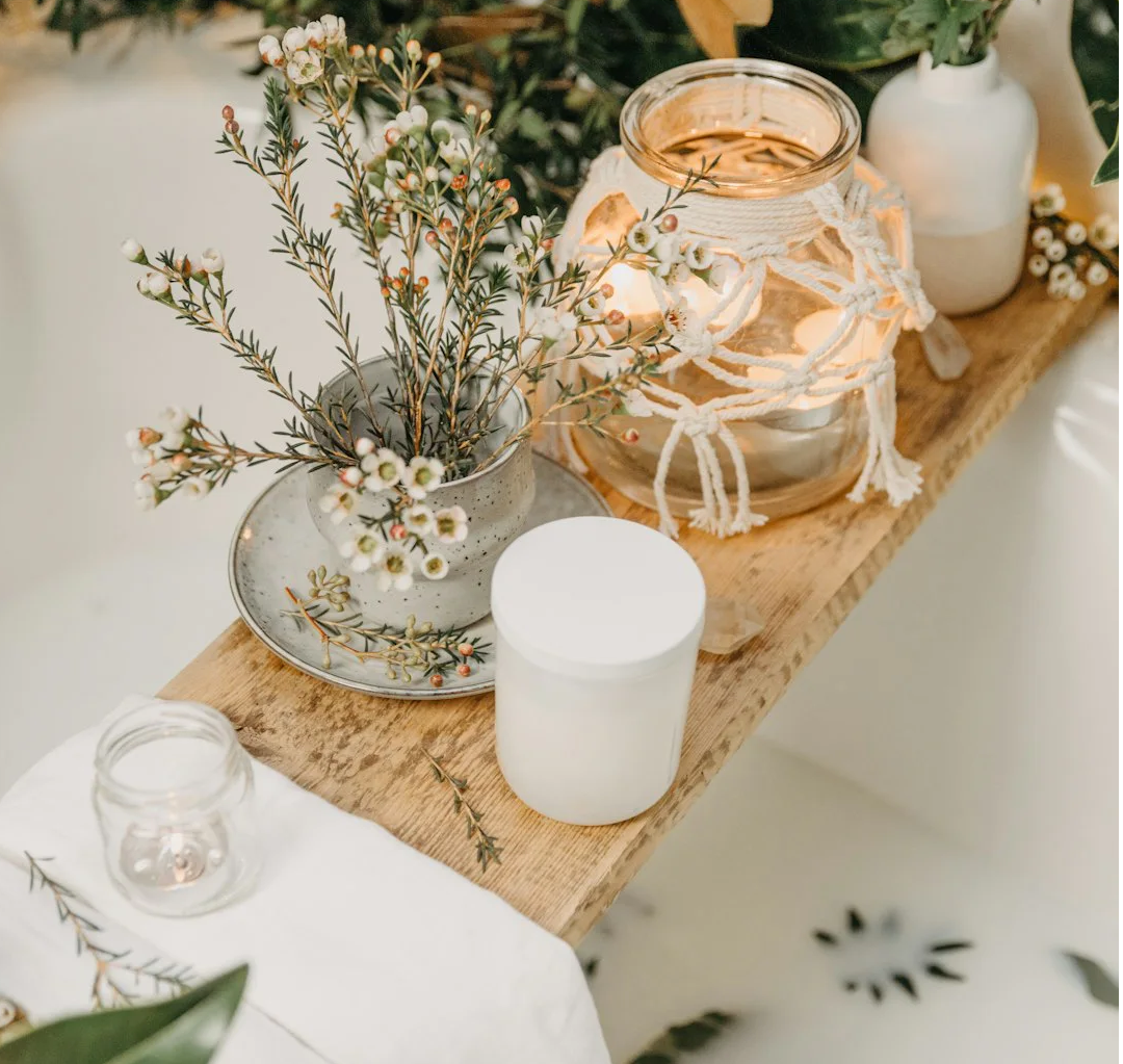 a table with a vase and glasses