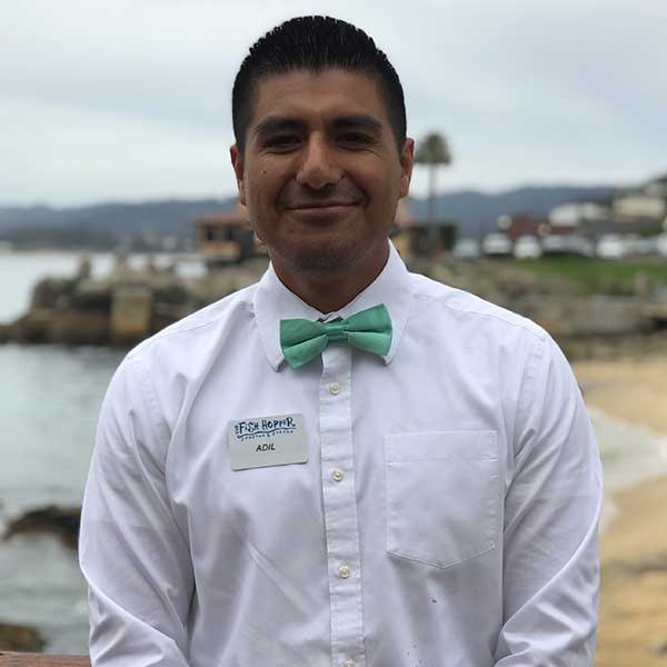Waiter wearing a seafoam bow tie