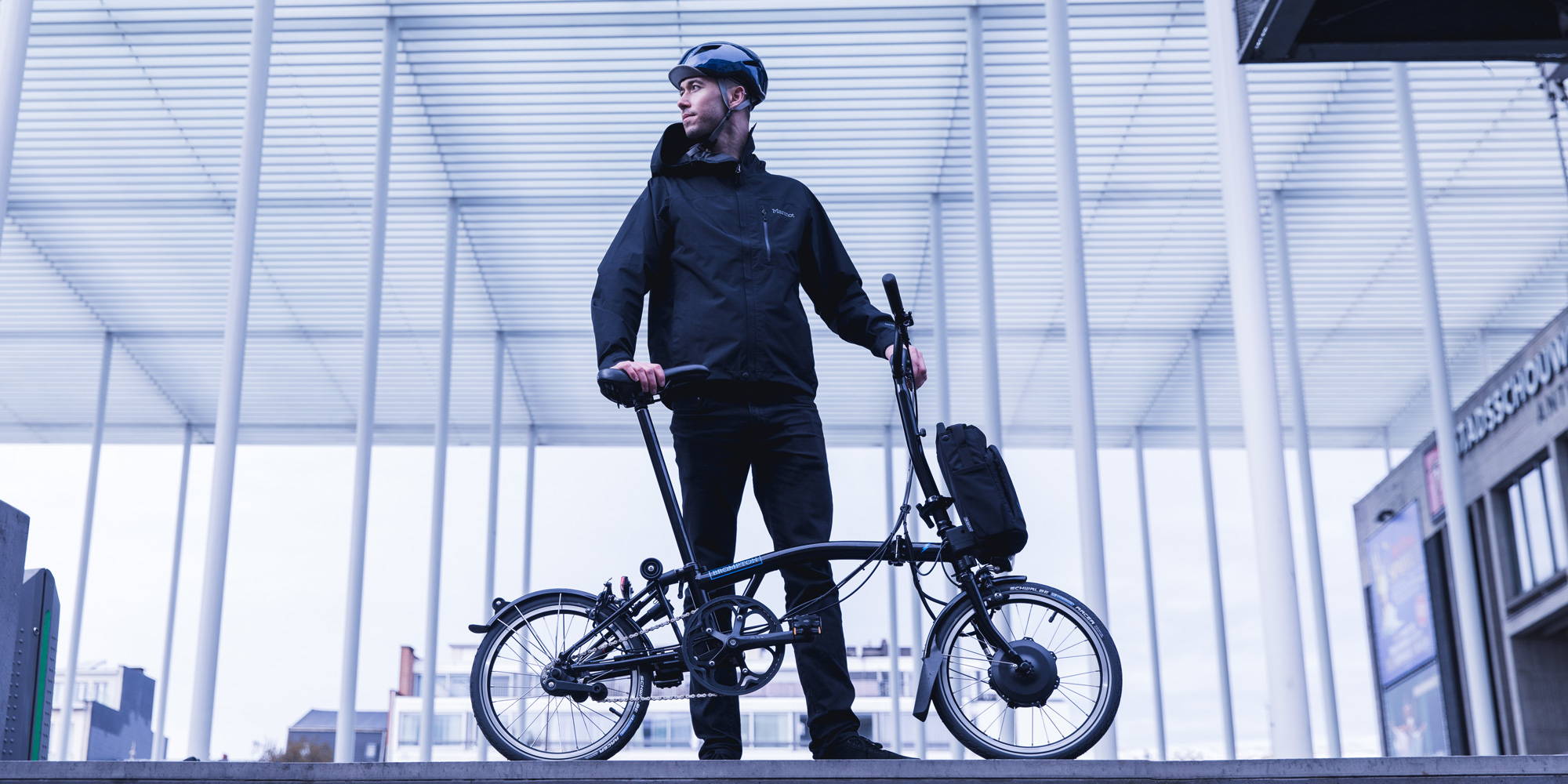 Man standing with a Brompton Electric bike