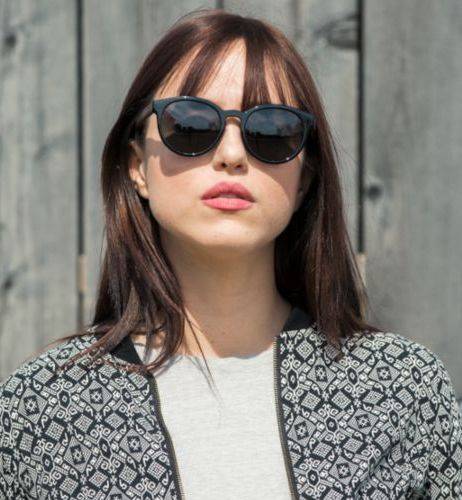 Woman wearing Luxy Round Black Affordable Sunglasses with Grey Polarized Lens.