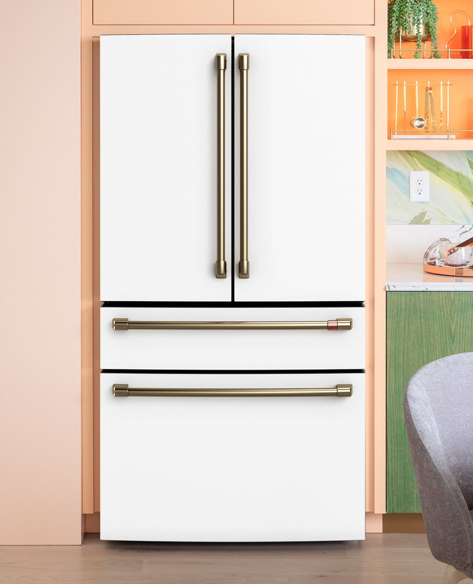Modern white refrigerator with two doors and two bottom drawers.