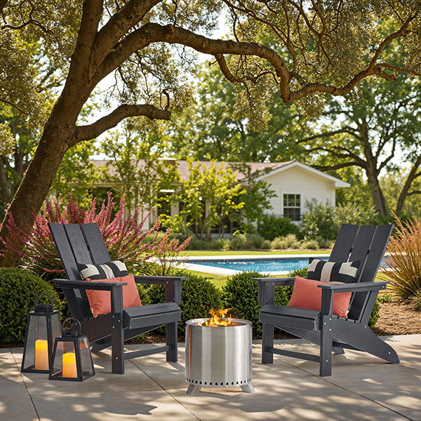 Two chairs by a fire pit in a garden setting.