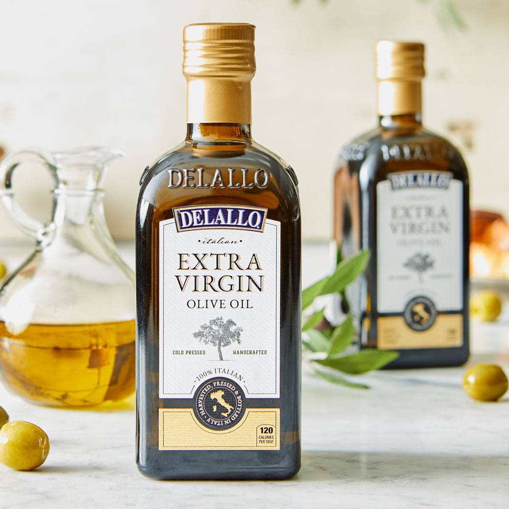 Product image of extra virgin olive oil in a glass bottle on a marble table